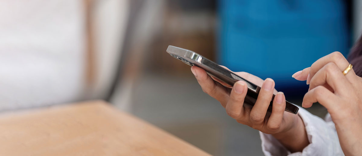 Woman using a Conversational AI chatbot on cellphone