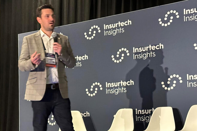 Danny Major on stage presenting OpenDialog at Insurtech Insights USA 2023