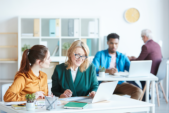 Diverse group of colleagues in small office