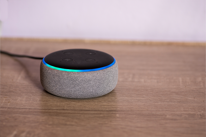 Alexa audio device on wooden desk