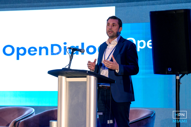 OpenDialog's SVP, Tom Blain, presenting on stage at HPN USA conference