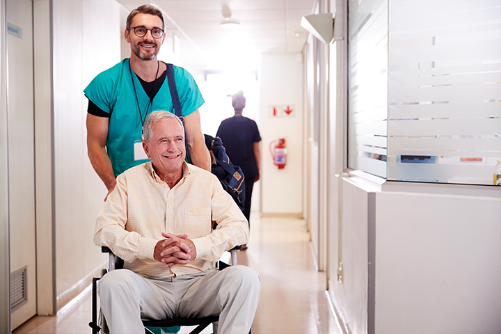 Patient being discharged from hospital in wheelchair